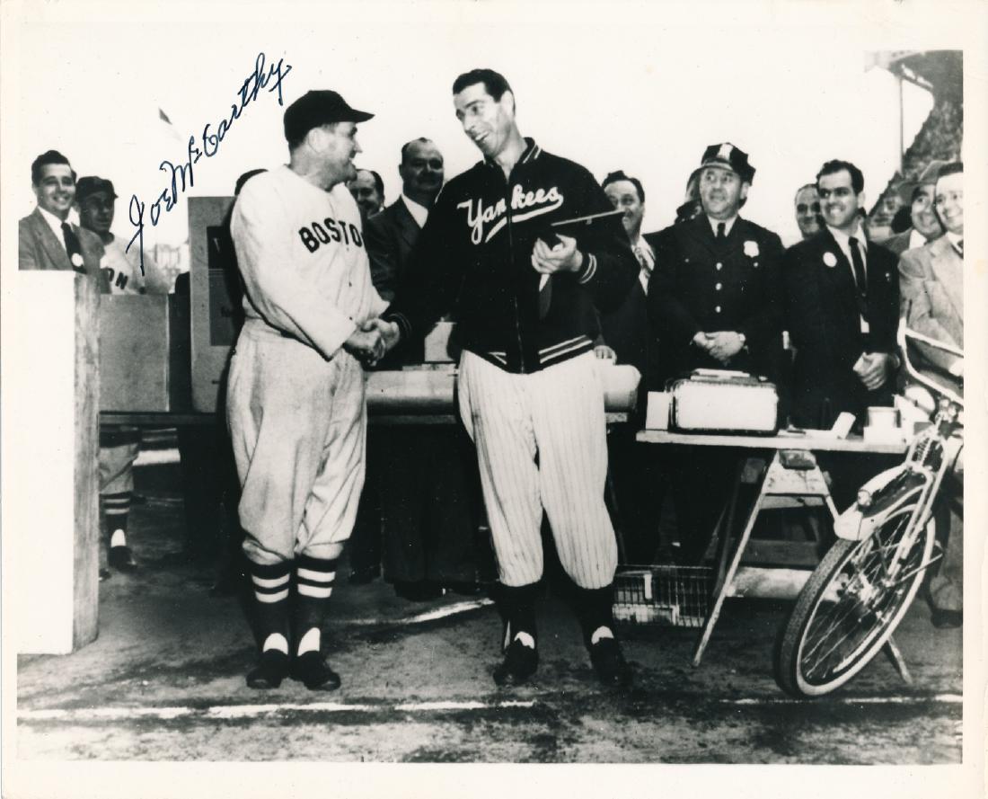 JOE MCCARTHY: (1877 - 1978) Baseball Hall of Famer, a manager who led the Yankees and was the first to win championships in both leagues. S.P., 10" x 8" b/w, shows McCarthy in later years as Red Sox coach shaking h