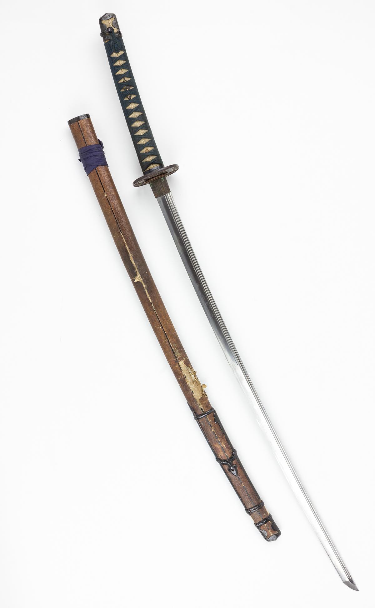CAPTURED JAPANESE "TACHI": FROM THE ESTATE OF GEN. CLARENCE R. HUEBNER, COMMANDER OF THE 1ST INFANTRY DIVISION IN THE FIRST WAVE AT OMAHA BEACH Finely-forged Japanese sword blade, measuring 30' from 'kissaki'(tip) to the habaki