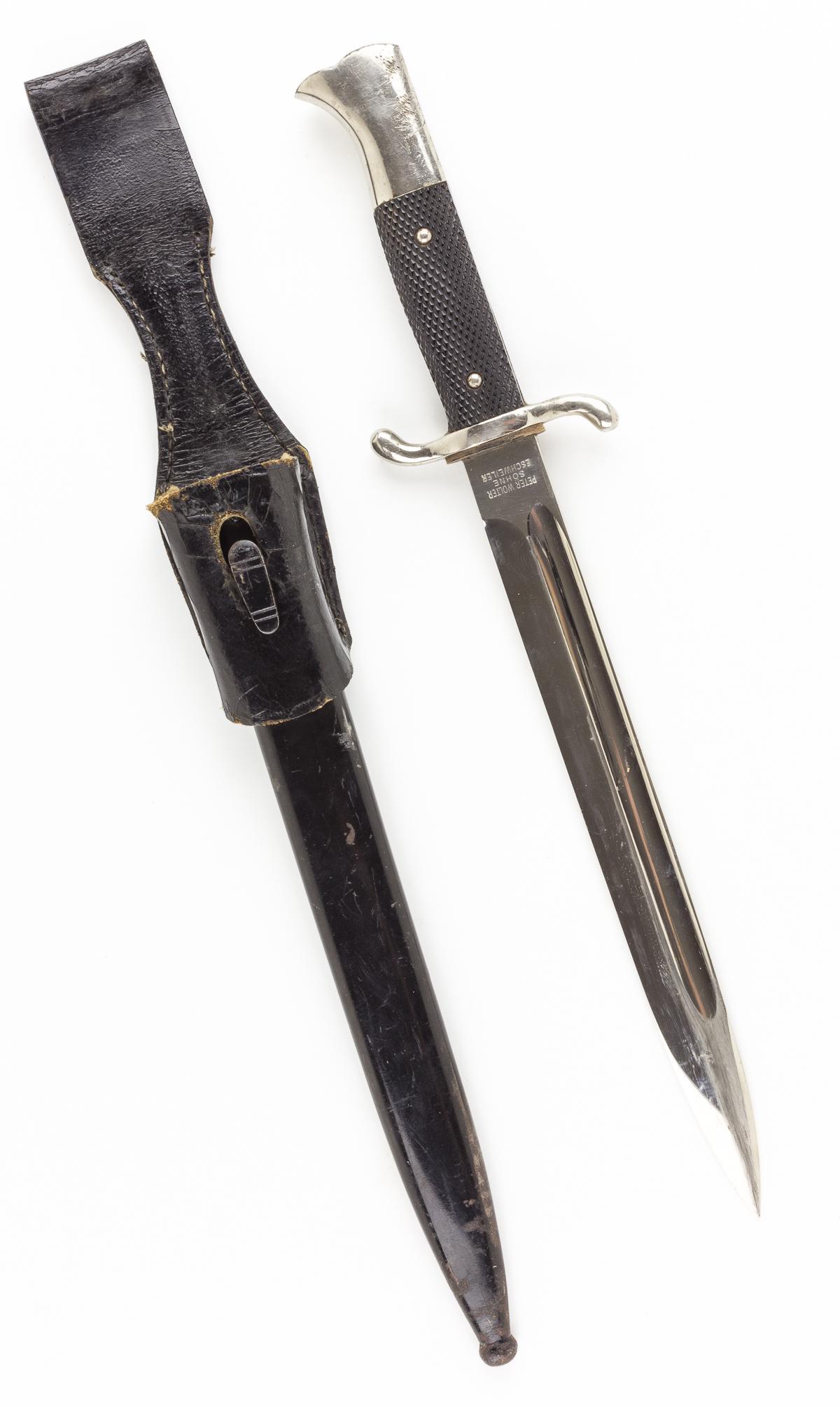 FIREMAN'S DRESS BAYONET BY WOLTER: Third Reich fireman's dress bayonet, 9 1/2' blade, 14 1/2' overall, with a nickel-plated bird's head pommel, black checked composite grips and 'S'-shaped quillions. The pommel shows some abrasions and