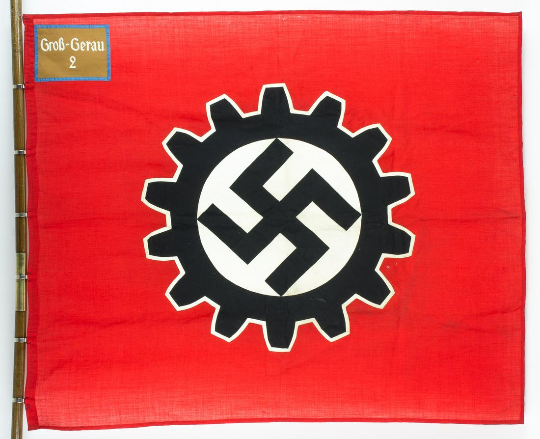 GROSS-GERAU D.A.F. ORTSGRUPPE FLAG: Deutsche Arbeitsfront (DAF) two-sided flag utilized by the Gross-Gerau local group, 55' x 46', a finely made wool bunting flag with separately constructed black 'gear', mobile swastika and white field