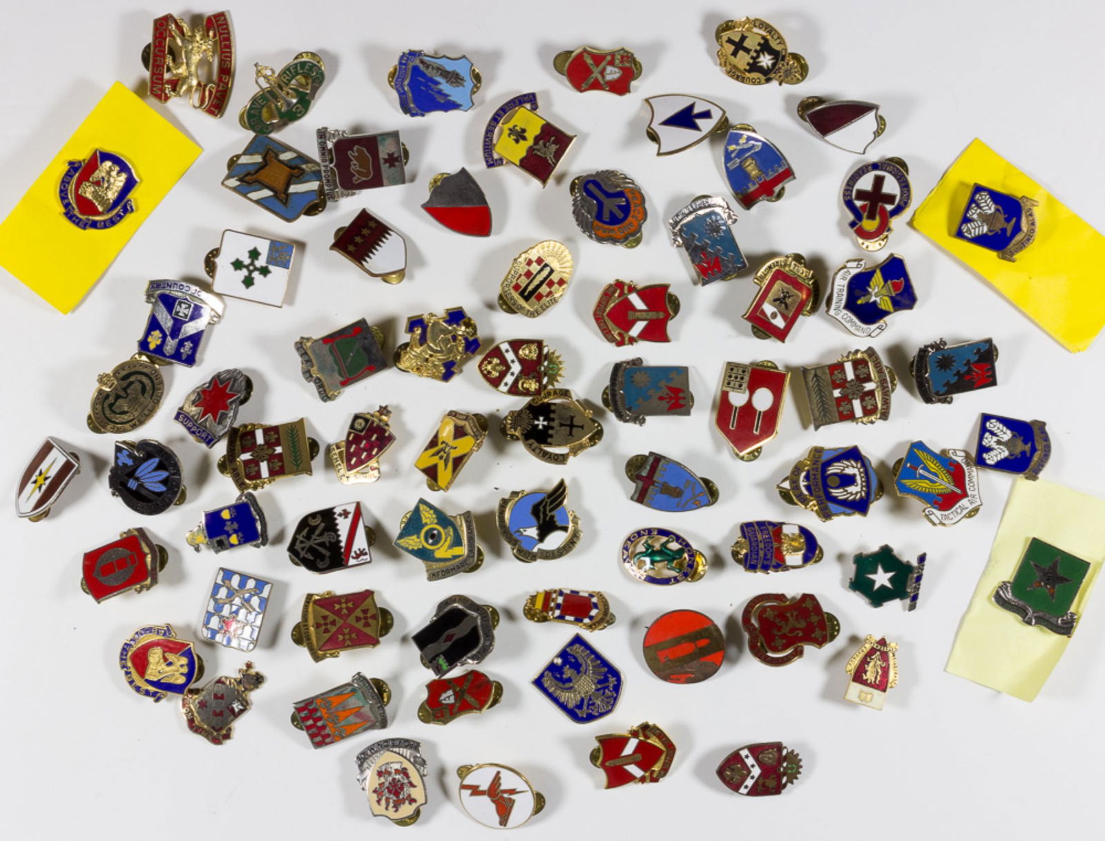 U.S. MILITARY DISTINCTIVE UNIT INSIGNIA PINS: Extensive lot of 68 post-World War II-era enameled metal pins, each featuring the distinctive unit insignia (DUI) of a U.S. military unit, including fighter and bombardment squadrons, infantry, engine