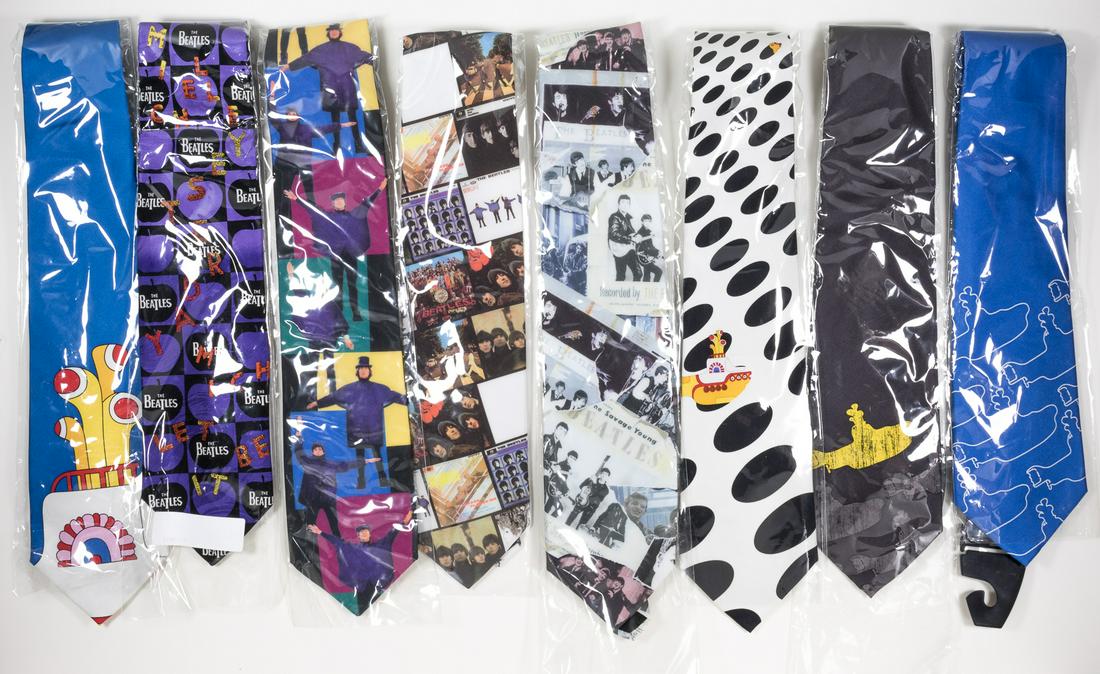 (BEATLES) BEATLE YELLOW SUBMARINE AND ALBUM NECKTIES: Good lot of eight Beatles licensed neckties, all unused and in original packaging. Includes four issued by Subafilms, 2006, one from Apple Corp.,. 1998, and three from four from Ralph Marlin, ca. 2000