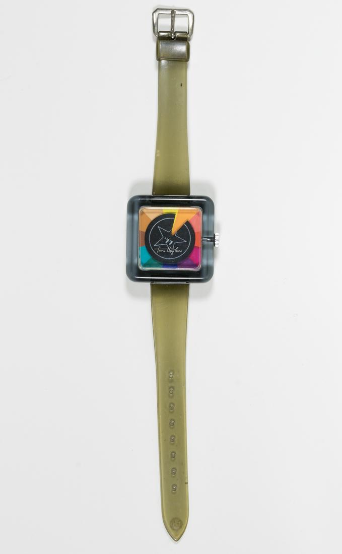 (BEATLES) RINGO STARR PROMOTIONAL "CHROMACHRON": Promotional wristwatch created for Ringo Starr by Tian Harlan, a German designer/artist known for his 'Chromachron' clock and watch concept. The watch bears a 1 1/2' square Lucite case with the mechan