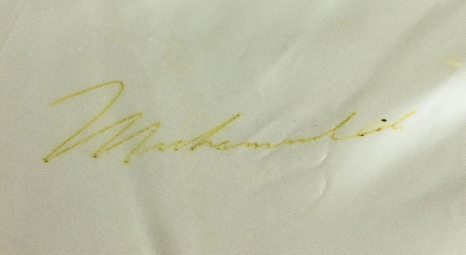 MUHAMMAD ALI: (1942-2016) American boxer and three-time heavyweight champion, stripped of his title for refusing military service. A fine signed Ali item, a pair of Everlast white acetate satin boxing trunks with a