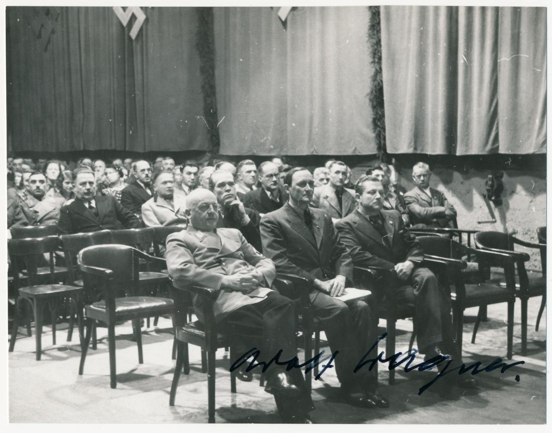 ADOLF WAGNER: (1890 - 1944) Gauleiter and Deputy Prime Minister of Bavaria and a leader in the "Night of the Long Knives". S.P., 5.5 x 4 in. b/w, showing Wagner in uniform seated among a crowd of men in suits. Wagn
