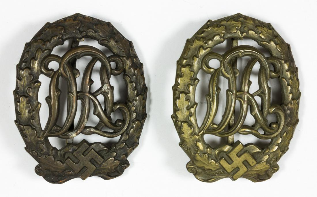 D.R.L. SPORT BADGES: Pair of D.R.L. Sport Badges, both gold and bronze marked: "WERNSTEIN JENA D.R.G.M. 35269". Very good.