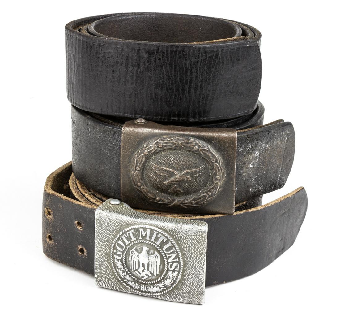 THIRD REICH BELT AND BUCKLE GROUPING (3): Lot of three World War II-era belts, includes: black leather belt, 40.5 x 1.75 in., unmarked, shows signs of repainting, else fine; black leather belt, 53 x 1.75 in., unmarked, fitted with an aluminum