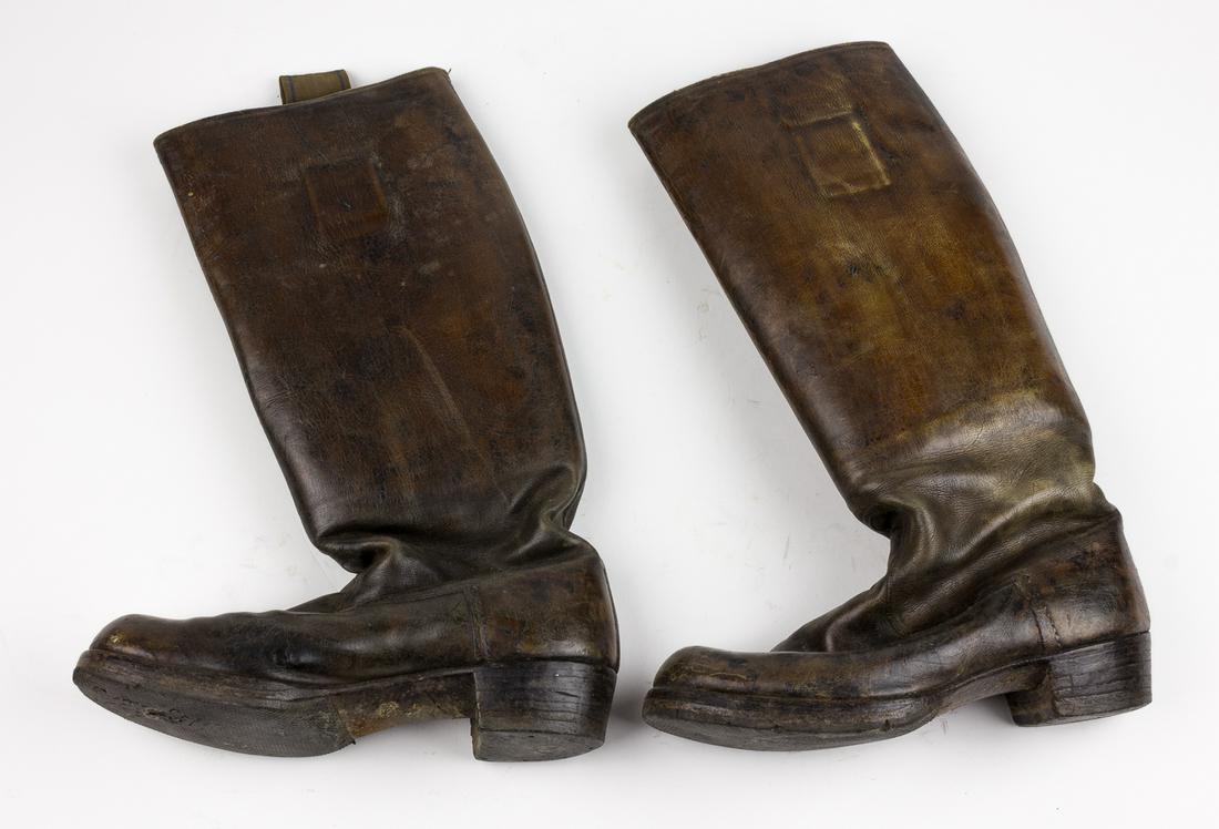 GERMAN BOOTS: Lot of two pairs of leather German officer's boots, each 17 in. tall with 11 in. soles. One pair is black, marked"42 7"Â on the sole with manufacturer"Gerding"Â written on the tag within, the other 