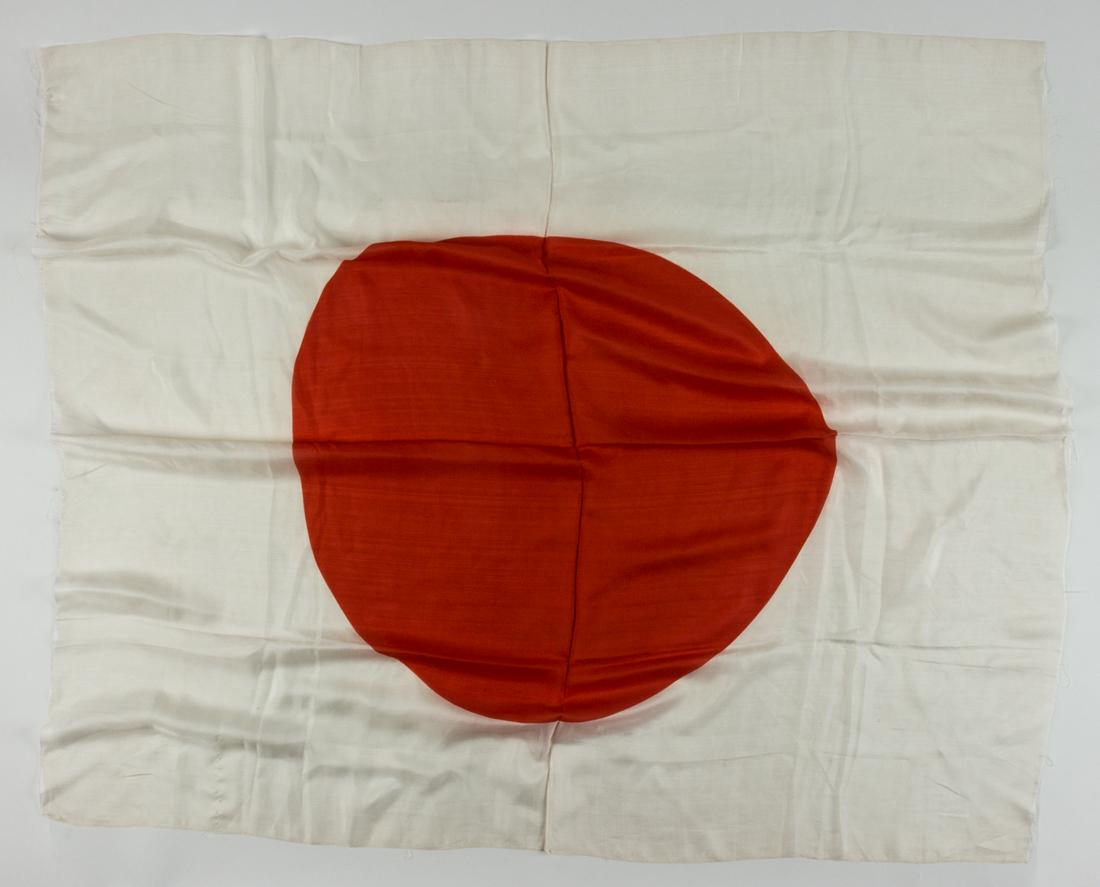 JAPANESE NATIONAL "MEATBALL" FLAG: Good-sized Japanese"meatball"Â flag, approx. 42 x 36 in. silk, clamp-dyed with a red"hinomaru"Â sun symbol at center. Slightly ragged edges with some loose threads, else fine.