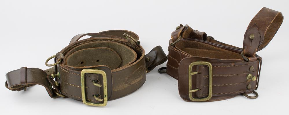 CANADIAN OFFICERS' "SAM BROWNE" BELTS: Good pair of World War I-era Canadian uniform belts, includes: named"Sam Browne"Â-style belt, 44"Â x 2 ¼", constructed of brown leather with brass double-pronged buckle, hooks and loops. The 