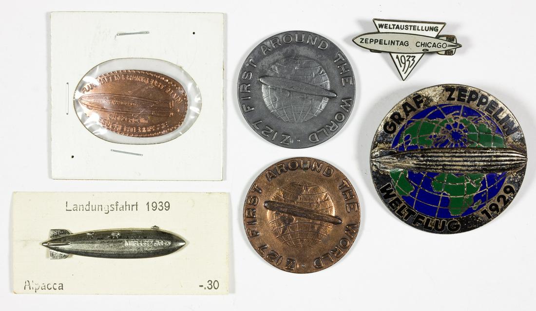 GRAF ZEPPELIN COINS AND BADGES (6): Grouping of six coins and badges involving the "Graf Zeppelin"Â, sold as-is. Good condition.