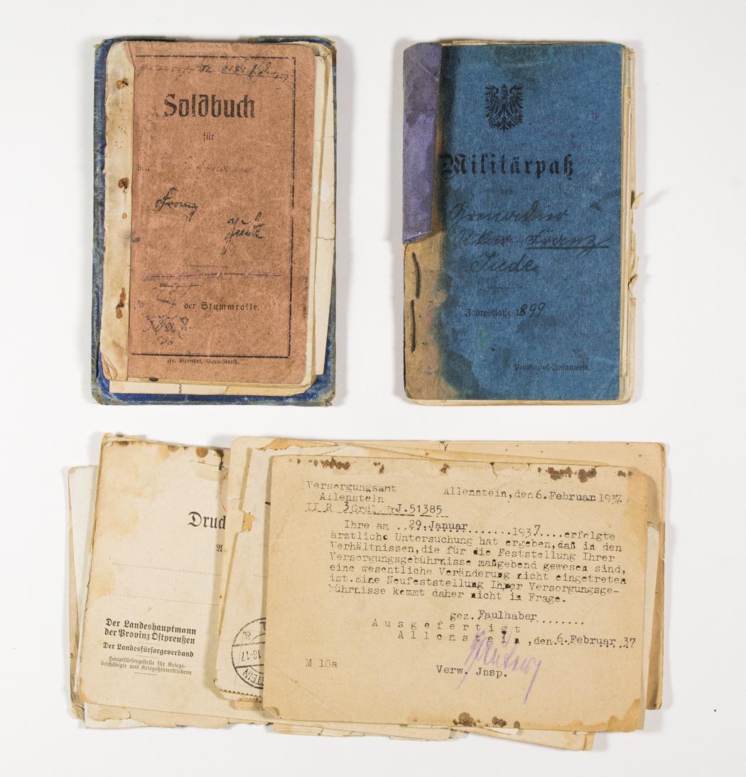 ARCHIVE OF GRENADIER "FRANZ JUDE": Group of 11 documents concerning grenadier Franz Jude from Konigsberg, a grenadier during World War I. Included is his military passport, soldbuch, award certificate for a Wound Badge in Black, 1918, 