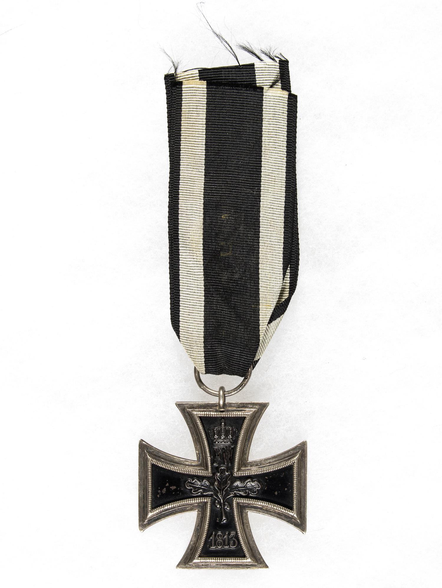 IRON CROSS, SECOND CLASS: Iron Cross 2nd Class approx. 1.75 in. square with silver frame and original ring marked "800" to indicate silver content. Slight paint loss else fine condition. Sold with ribbon.