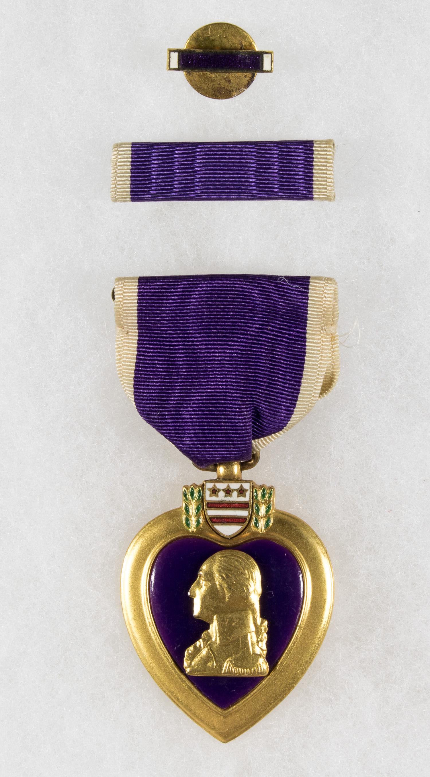 PURPLE HEART NAMED TO SAILOR K.I.A. BY A GERMAN U-BOAT: Very interesting association U.S. Purple Heart medal complete with ribbon bar lapel pin and presentation case named to Robert Thomas Smith of Ohio who served as a Machinist's Mate 2nd Class aboard the