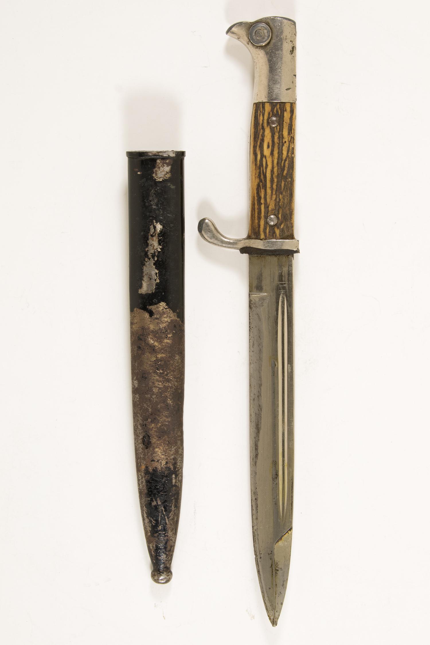 STAG HORN BAYONET BY EICKHORN: Stag horn grip bayonet by Carl Eickhorn a dress bayonet with nickel-silver dome rivets pommel head and guard showing showing significant wear the grips remaining very good and the 7.5 in. blade showin