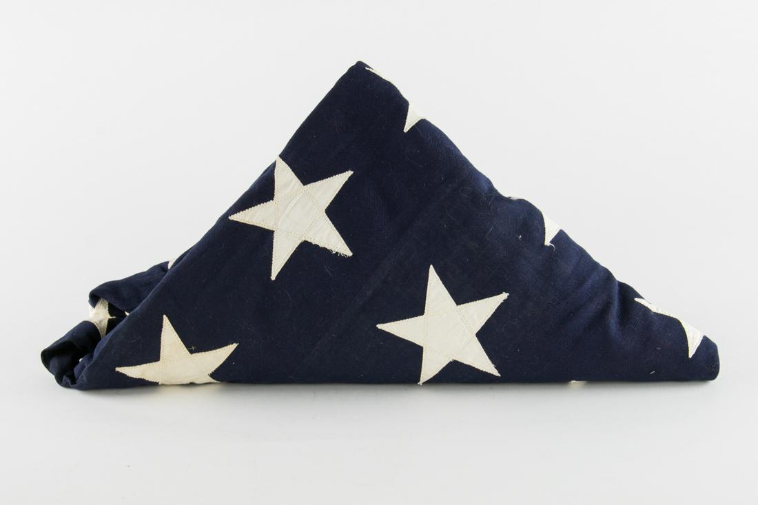 48-STAR AMERICAN FLAG: 48-star American flag high-quality cotton construction 5 ft. x 9.5 ft. constructed of individually-sewn cotton stripes and stars reinforced hoist with brass grommets and maker's ink stamp. Fine.