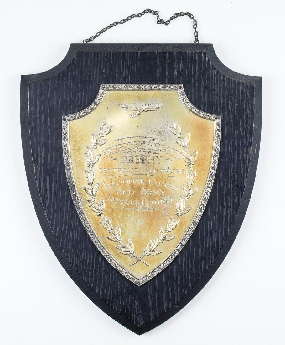 MAJOR GEN. CALEB VANCE HAYNESâ€™ PRESENTATION PLAQUE: Wood mounted gilt plaque presented to future general Caleb Vance Haynes. The plaque 15 x 12.5 in. overall is engraved: â€œAMERICAN LEGION TROPHY CENTRALIA AUG. 9 1928 NATIONAL GUARD AND ARMY RESER