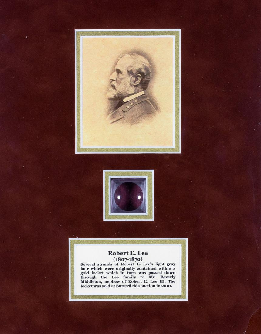 A LOCK OF ROBERT E. LEE'S HAIR: An neat relic two strands of hair which once graced the head of Gen. Robert E. Lee. The hair was once contained within a locket obtained by our consignor from Butterfield's in Los Angeles in 2001. The