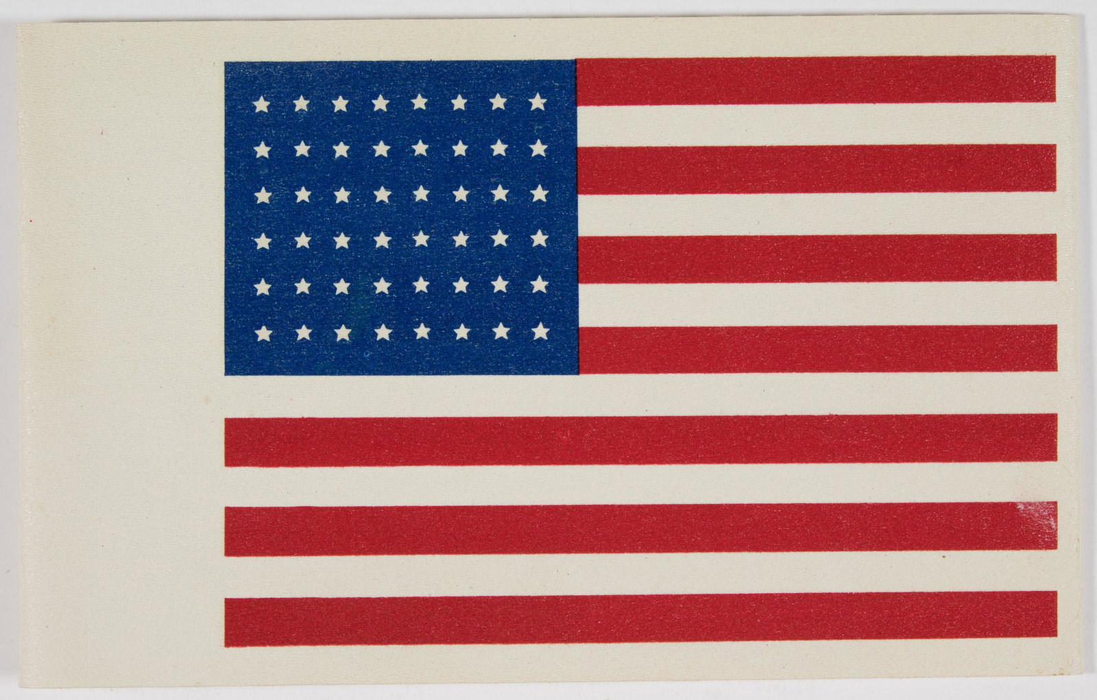 AMERICAN D-DAY PARATROOPER ARMBAND: Rare oilcloth armband, approx. 17 x 4 in., used by U.S. paratroopers during the D-Day invasion to identify themselves as Americans to the local populace and to approaching friendly forces. The armband