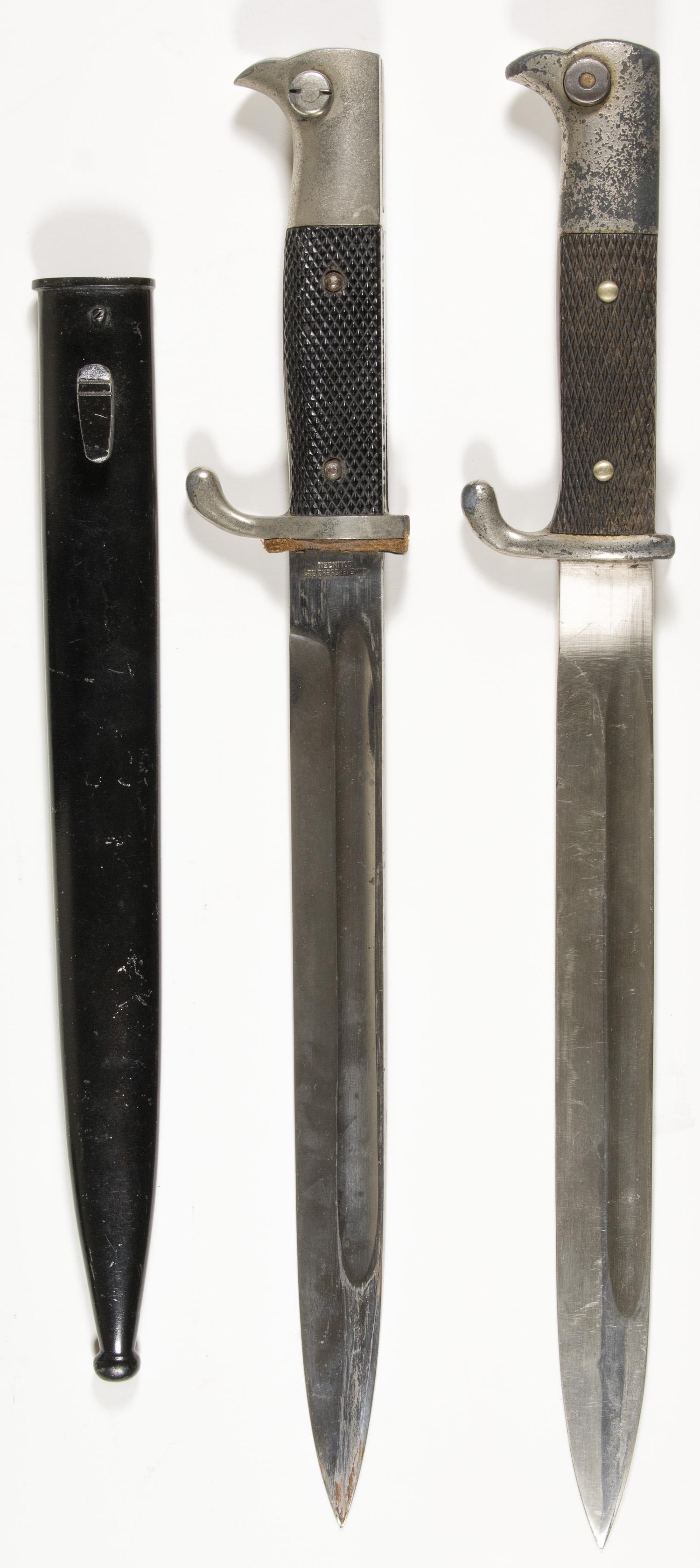GERMAN K98 BAYONETS (2): Pair of German K98 bayonets, one marked by Weyersberg, black checkered grip, lightly oxidized fittings, with black scabbard; the second very slightly larger in the grip, fittings worn and oxidized, ma