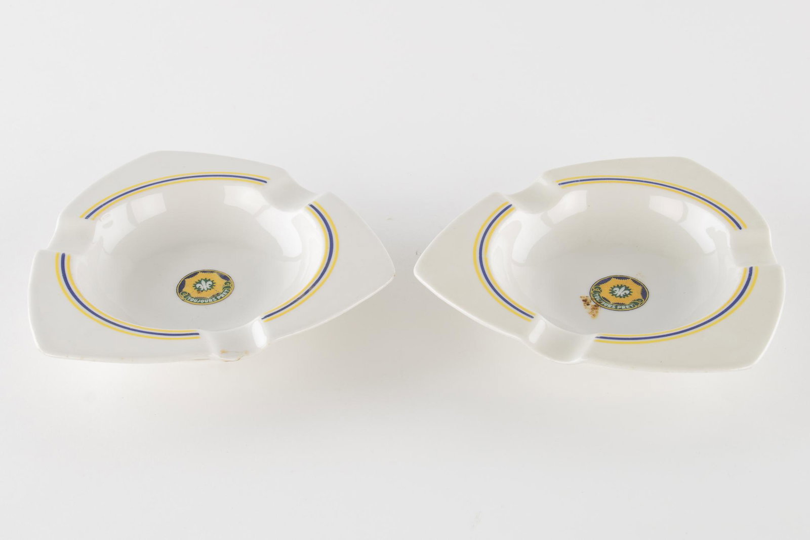 2ND ARMORED CAVALRY ASHTRAYS, ESTATE OF GEN. HUEBNER: A pair of German-made porcelain ashtrays from the estate of CLARENCE R. HUEBNER (1888-1972), commander of the 1st Infantry Division, popularly known as the 'Big Red One' during the D-Day landings on J