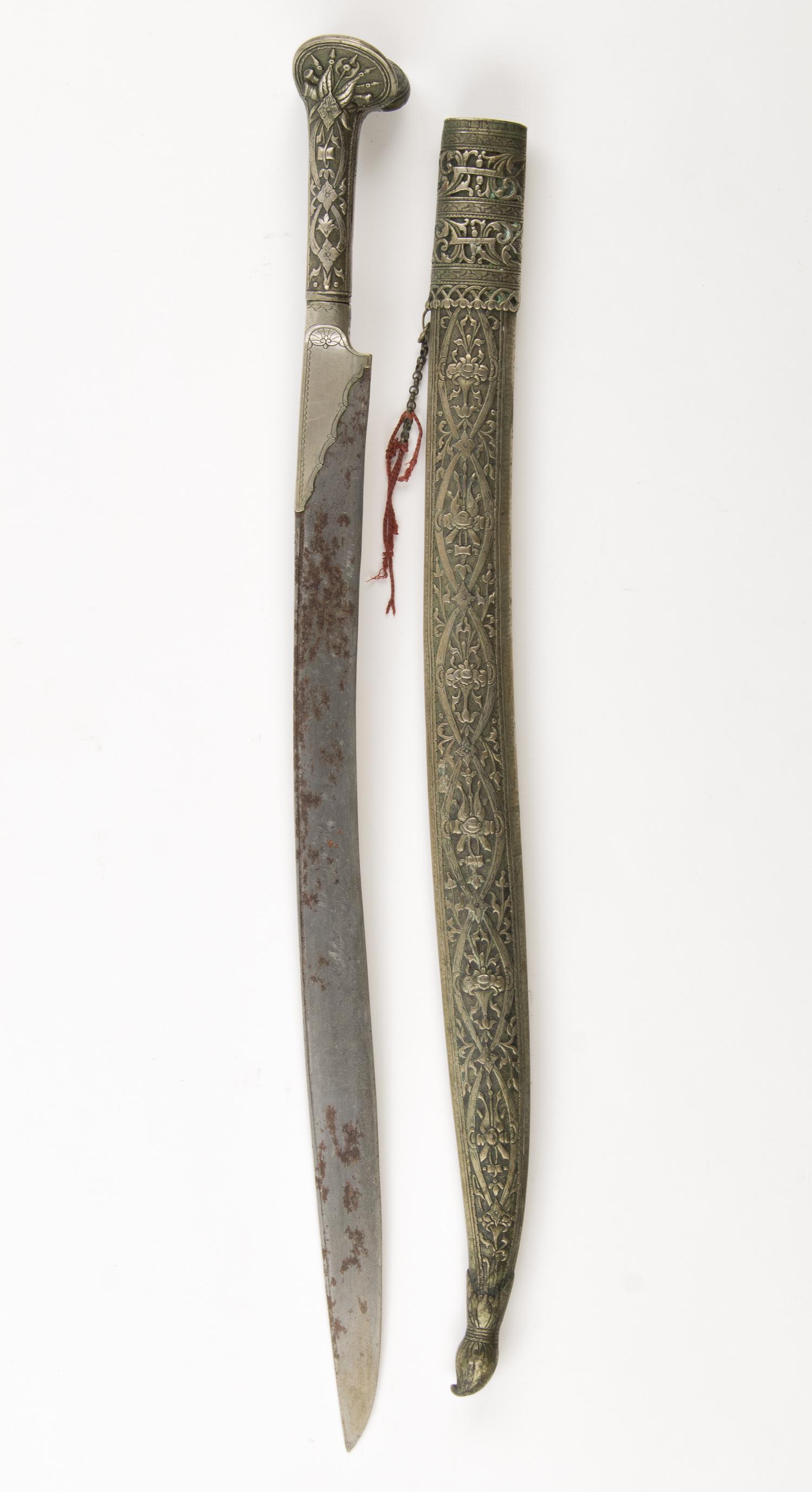 OTTOMAN EMPIRE (BALKAN) YATAGAN SWORD: Turkish yatagan single-edged sword with scabbard, split pommel with images of halberds and pikes, the 19 in. steel blade still sharp but showing oxidation. Scabbard also bears quality workmanship, som