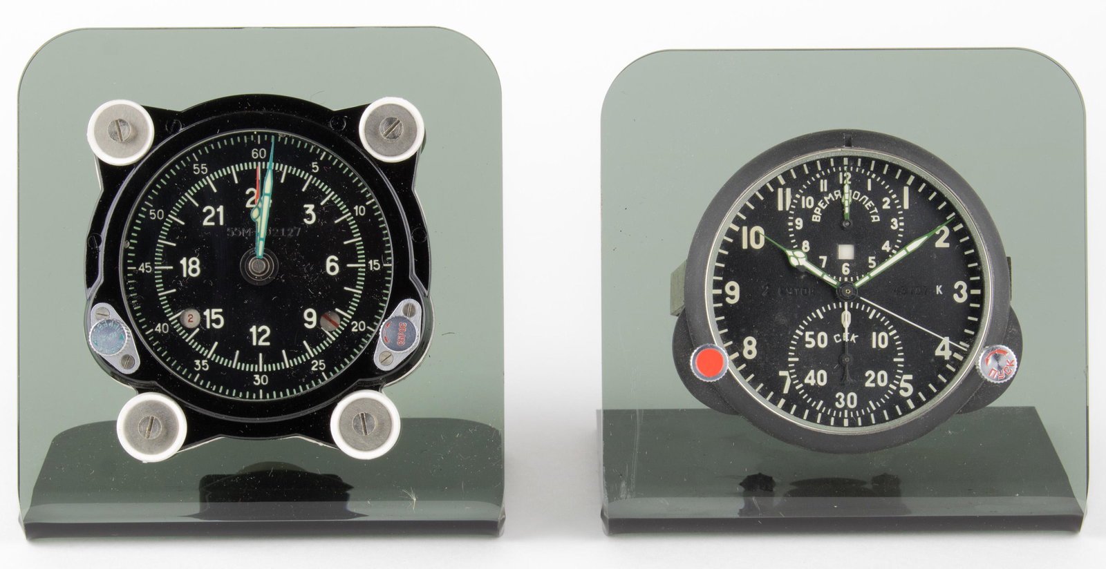 RUSSIAN NUCLEAR 'DOOMSDAY' CLOCKS: Great pair of rare Russian 'Doomsday' clocks from decommissioned Tupolev long-range bombers, each approx. 3.5 in. dia., designed for use in Soviet nuclear weapons. Mounted onto lucite stands. One is s