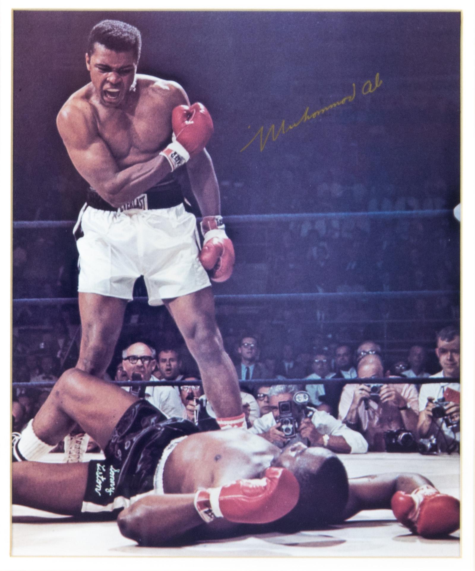 MUHAMMAD ALI: MUHAMMAD ALI (1942 - 2016) American boxer and three time heavyweight champion, stripped of his title for refusing military service. Excellent signed photo, 7.5 x 9 in. color (sight), an iconic view of