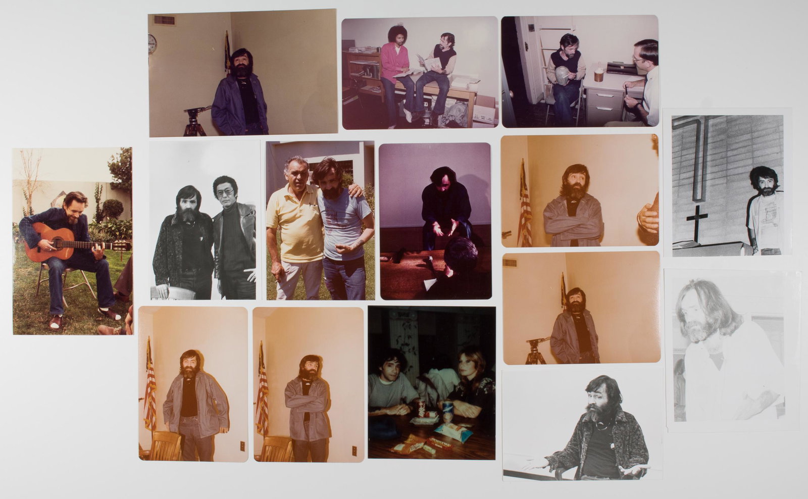 CHARLES MANSON PHOTOGRAPH GROUPING: Lot of eight original 5 x 3.5 in. b/w photographs of Manson 'cleaned up' and outside prison walls, likely promotional or press shots used in conjunction with the release of his autobiography. Very fin