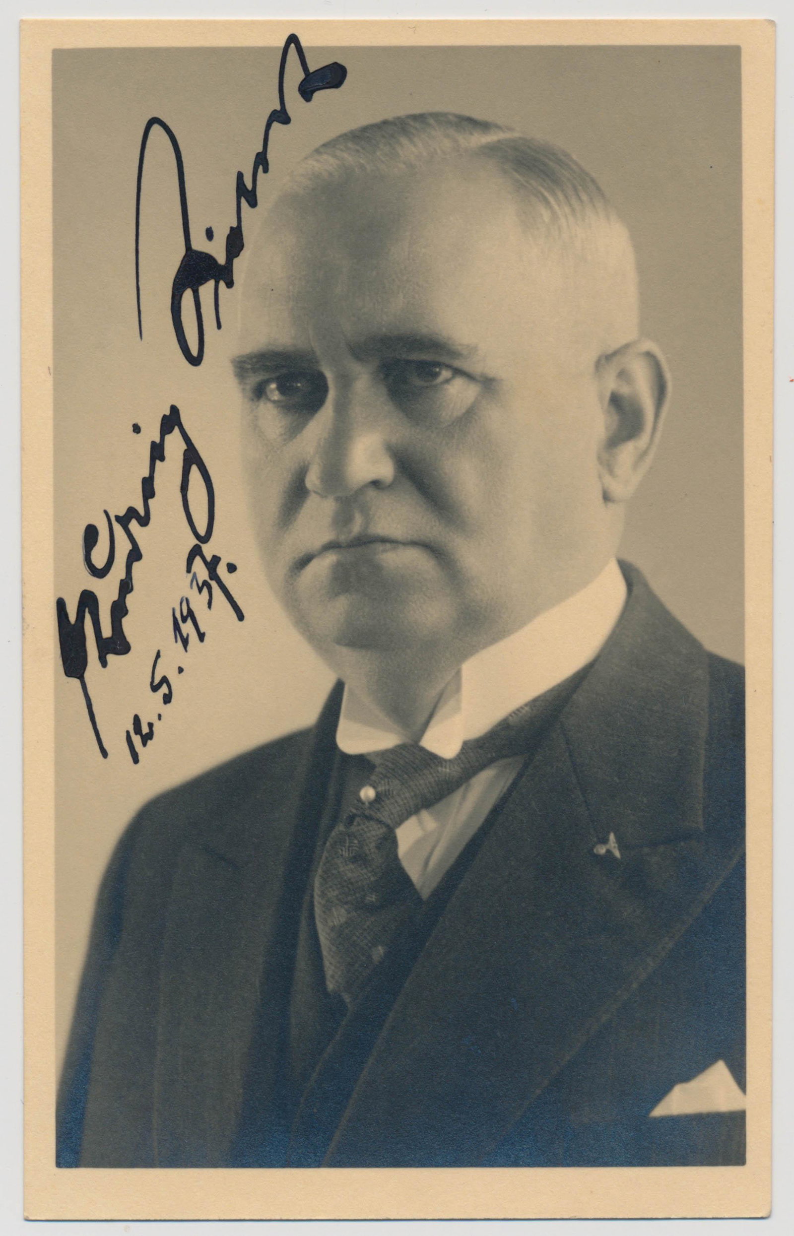 LUDWIG SIEBERT: (1874 - 1942) Nazi politician and Bavarian prime minister from 1933 to 1942. Prewar S.P., a chest-up portrait postcard of Siebert in a business suit wearing a 'swastika eagle' lapel pin, signed boldly