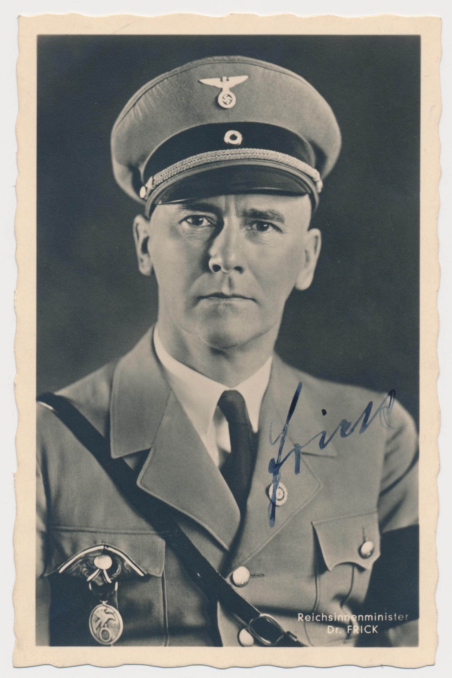WILHELM FRICK: (1877 - 1946) Nazi Minister of the Interior, author of the Nuremberg Laws. Hanged at Nuremberg for his crimes. S.P., 3.5 x 5.5 b/w. a chest, up pose in uniform by Hoffmann, nicely signed at right. Fin