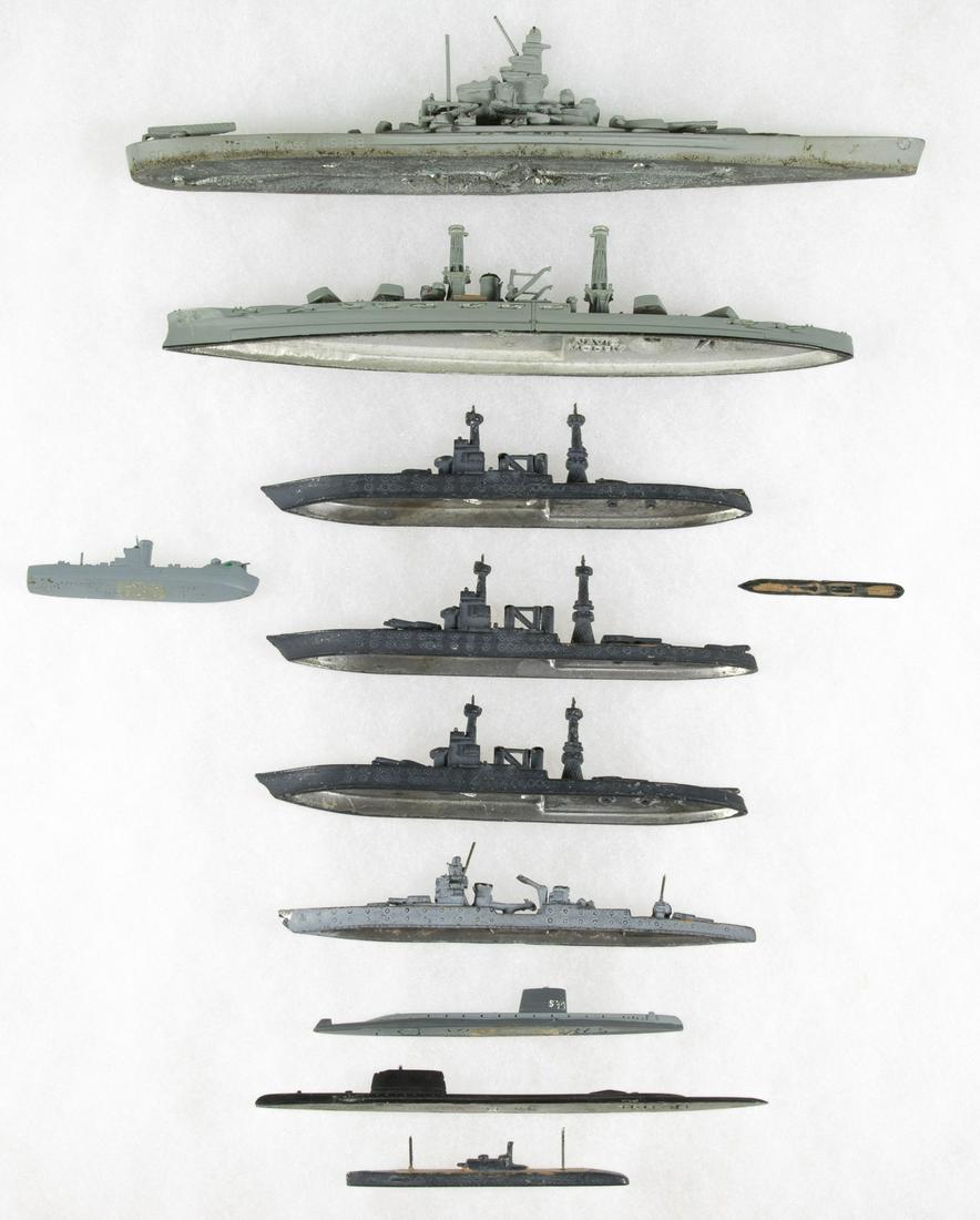 AMERICAN WARSHIP MODELS (11): Lot of eleven miniature ship models of World War II-date ships, most presumed American warships, including four damaged on Battleship Row at Pearl Harbor. The largest two out of the group being 6.75 i