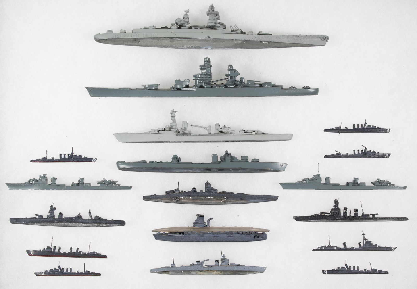FRENCH WARSHIP MODELS (18): Lot of eighteen miniature ship models of World War II-date French warships, the longest two measuring 8 in. long, includes: 'Richelieu'; 'Suffren'; 'Emile Bertin', manufactured by H. A. Framburg; five