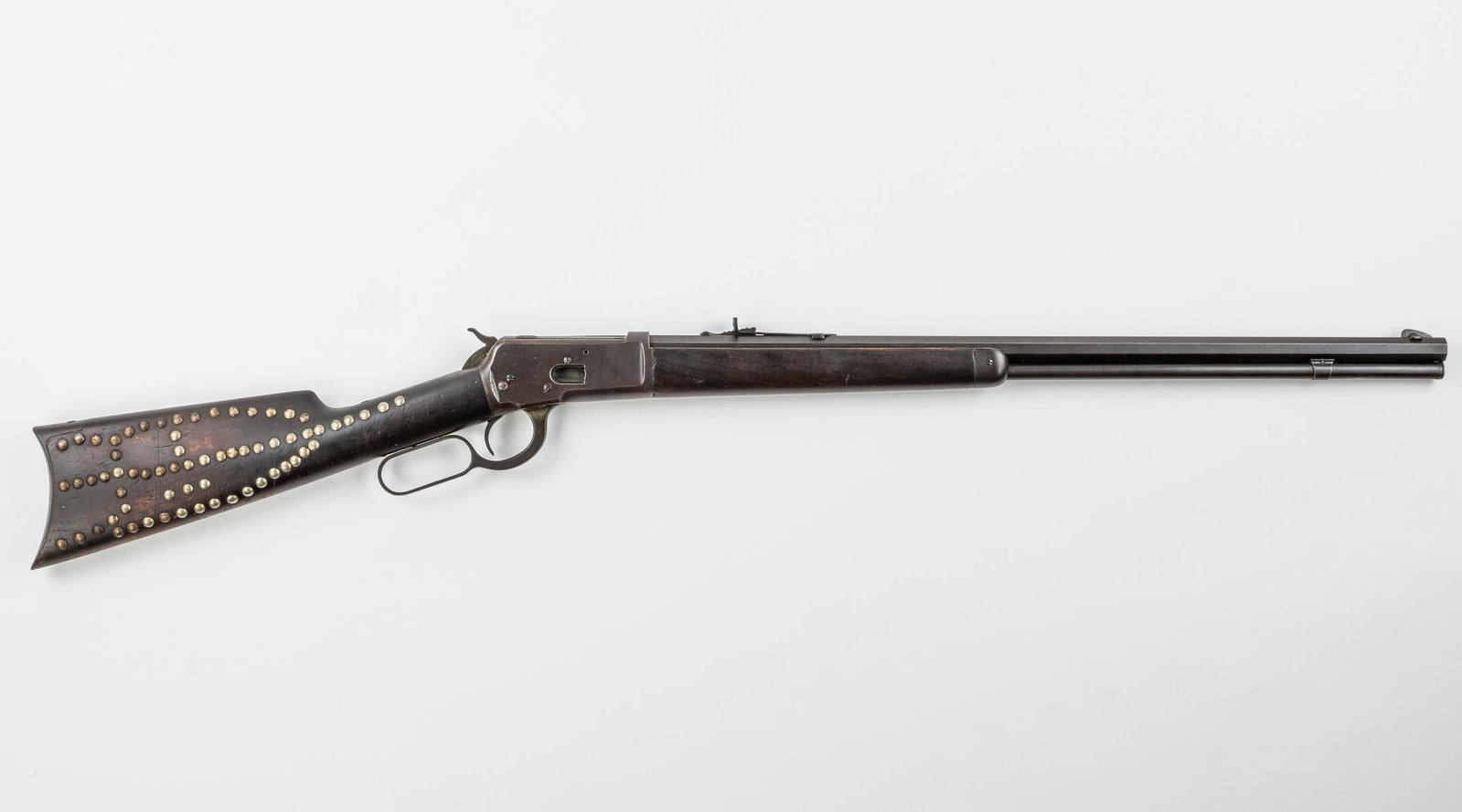 WINCHESTER MODEL 1892, .32-20 W.C.F., CA. 1896: Winchester Model 1892 lever action rifle fitted with a 24-inch hexagonal barrel, full length tube magazine, open sight with peep, chambered for .32-20 WCF. Serial no. 112660 dates the rifle to ca. 189