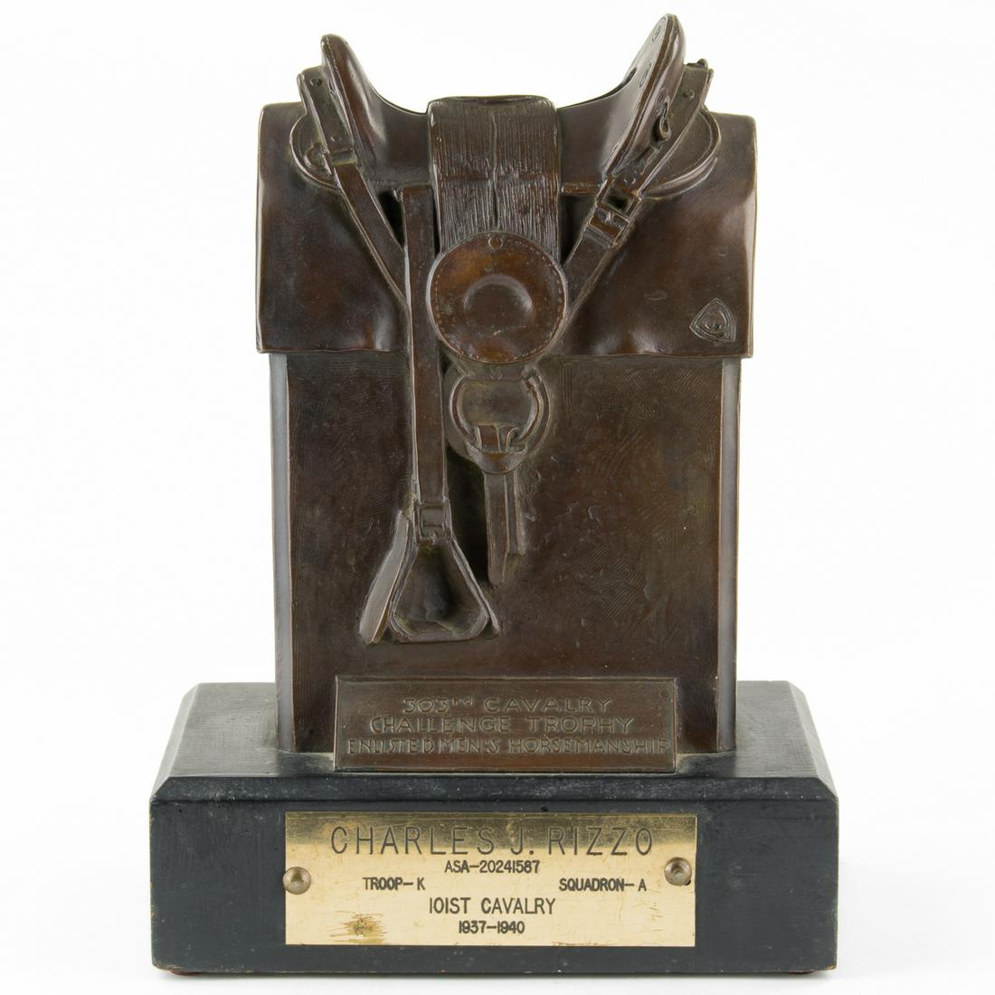 PRE-WAR HORSEMANSHIP TROPHY BELONGING TO THE 101ST: A truly one-of-a-kind Army-issue award permanently issued to the 101st Cavalry Division, approx. 11 in. tall x 7.5 in. wide x 3.25 in. long, a horsemanship award taking the shape of a McClellan saddle