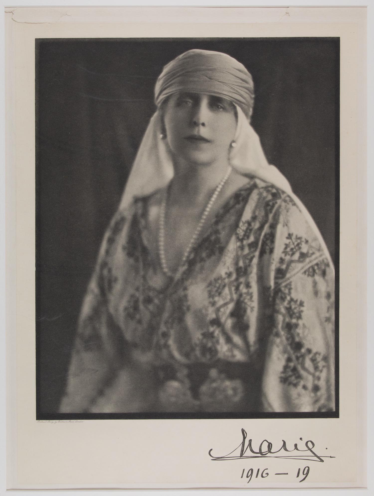 MARIE OF ROMANIA: (1875-1938) was Queen consort of Romania from 1914 to 1927, as the wife of Ferdinand I of Romania. S.P. 9.75 in. x 12 in., b/w, 1917, standing pose dressed in royal attire, signed on the bottom right