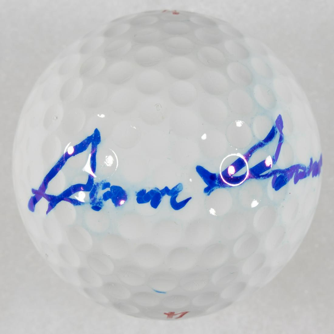 SAM SNEAD: (1912-2002) American professional golfer, winner of over 90 PGA tour events, regarded as one of the best golfers in history. Signed regulation 'Spalding' golf ball, boldly signed in blue Sharpie and h
