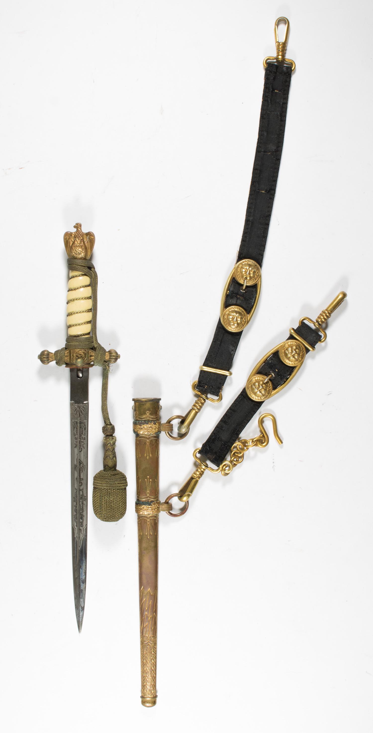 KRIEGSMARINE ENGRAVED DAGGER WITH SCABBARD & HANGER: Very scarce Second Model dagger belonging to a Kriegsmarine line officer, 9.75 in. blade, 15 in. overall, bearing a double-sided engraved blade, white celluloid grip, and still-tightly wound gilt wire