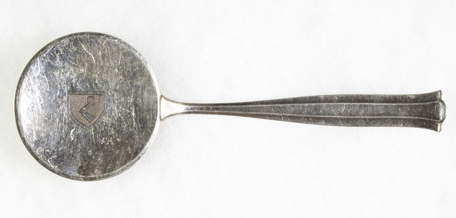 HERMANN GORING ASPIC SPOON: A fine aspic style silver plated spoon once owned by Luftwaffe commander Hermann Goring (1893-1946). The 7 in. spoon has a flat head with a 2.5 in. dia. and would have been used for eating aspic, a ty