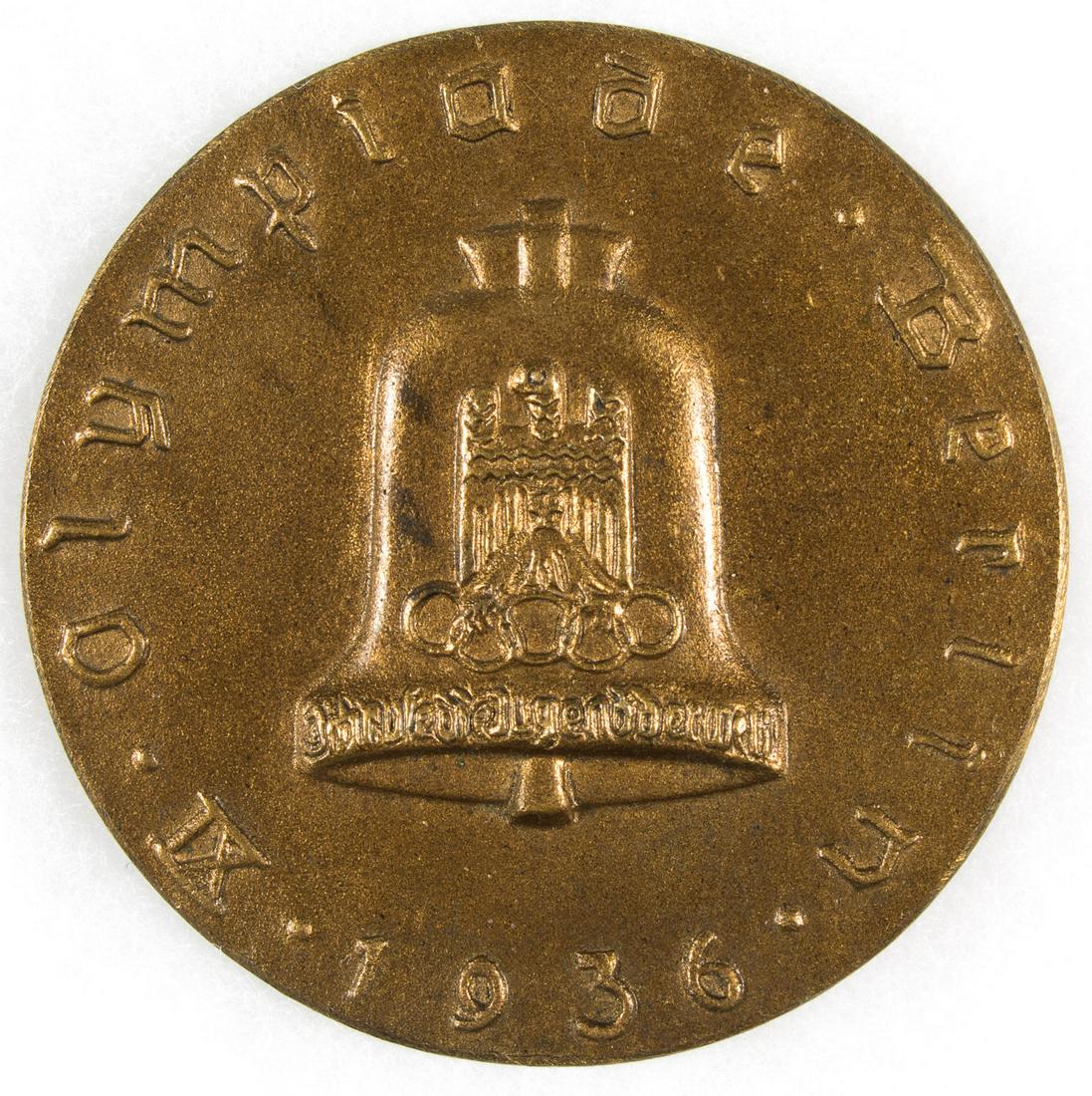 1936 BERLIN OLYMPIC AUTOMOBILE RALLY TABLE MEDAL: Cast bronze table medal commemorating the 1936 Berlin Olympic Automobile rally, 2.75 in. dia., featuring the Berlin Olympic bell at the center and the label 'XI Olympiad Berlin 1936' around the perime