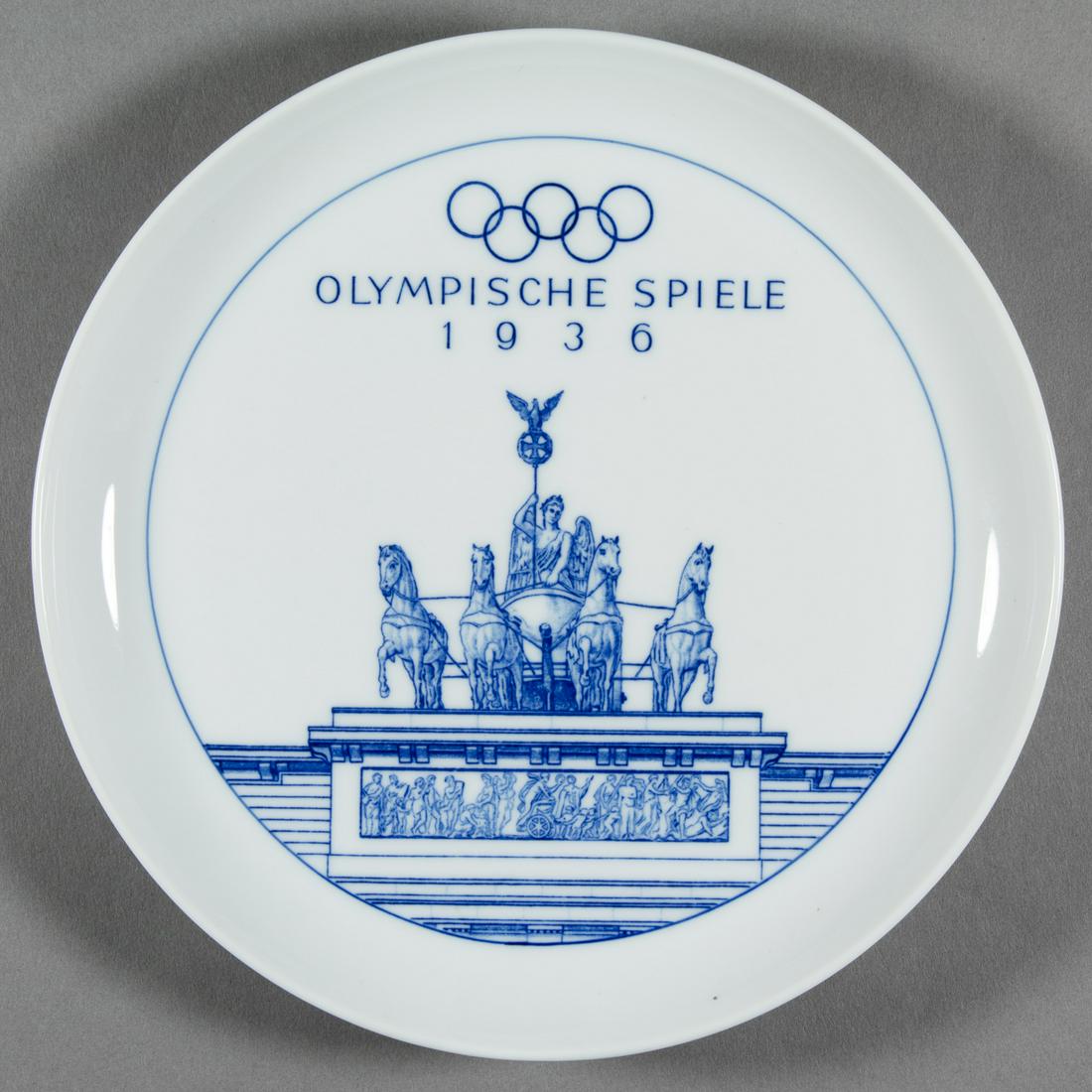 1936 OLYMPICS PORCELAIN PLATE BY MEISSEN: An excellent piece of Olympic memorabilia, a 1936 Olympic Games commemorative plate by famous German porcelain manufacturers Meissen. The 7 in. diameter plate displays an image of the statuary atop th