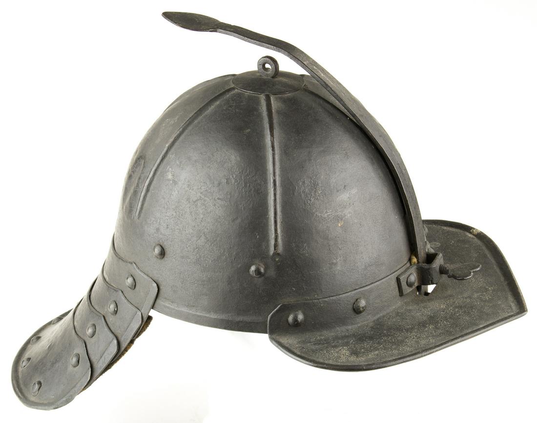 DUTCH LOBSTER TAIL POT HELMET: Dutch lobster tail pot helmet, approx. 8.25 in. wide x 16 in. long x 6 in. tall, ca. 17th century, with plate-articulated neck guard, fixed peak with thumb screw adjustable nasal bar, and tapered ear 