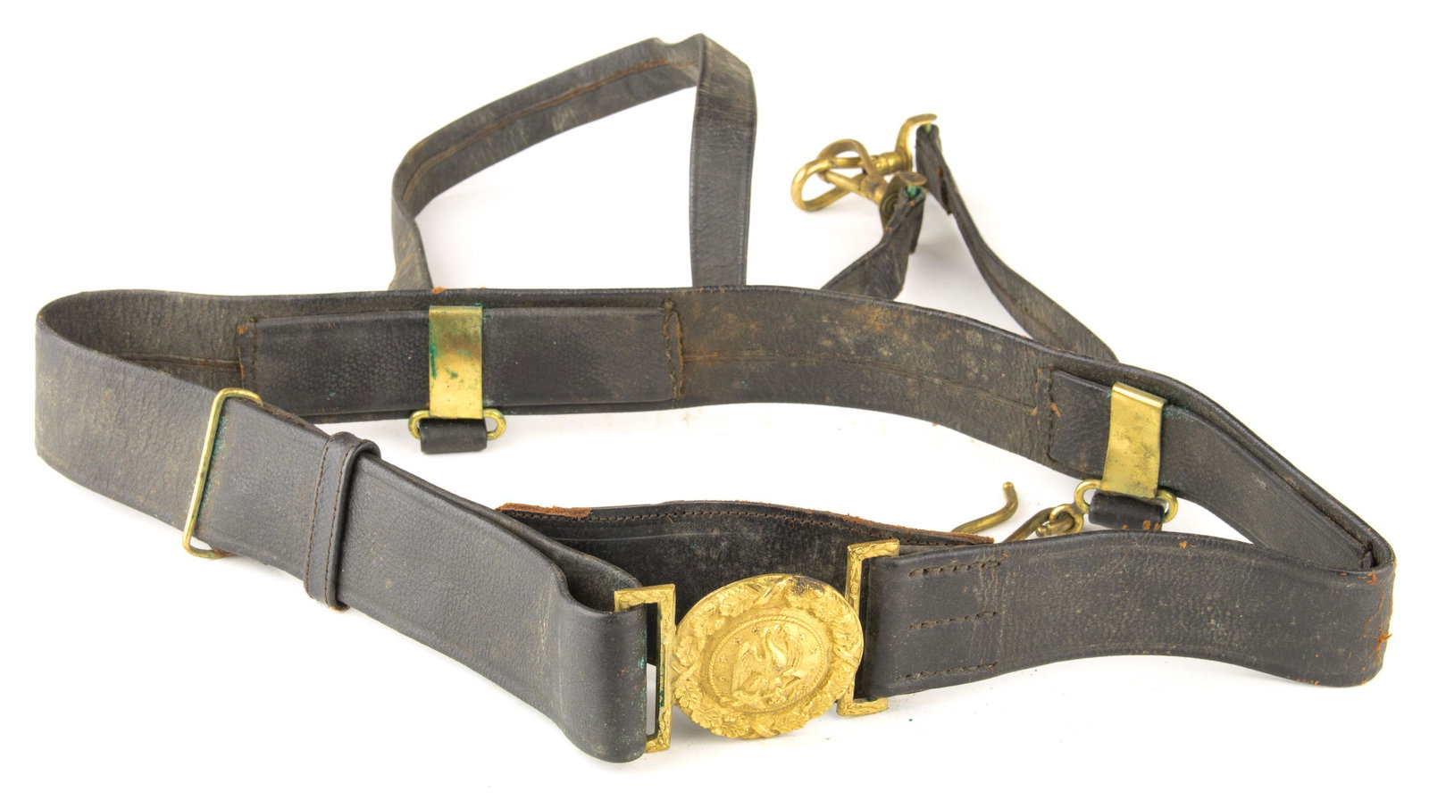 SPANISH-AMERICAN WAR U.S. NAVY OFFICER'S BELT AND: Scarce two-piece brass buckle and belt owned by a Spanish-American War-era U.S. Navy officer, the reverse of the buckle tarnished, the leather a bit cracked and worn yet still supple.