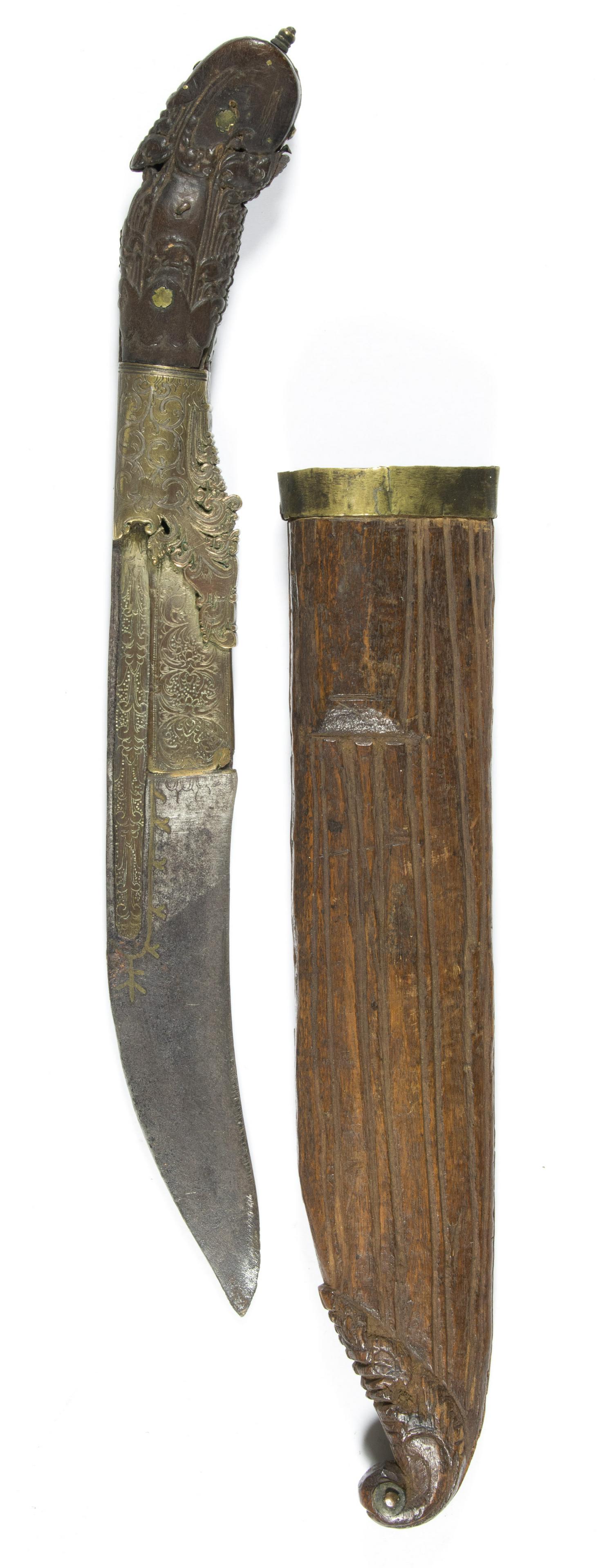FAR EASTERN DAGGER AND SCABBARD: Far Eastern, possibly Malaysian, dagger with extravagantly carved and engraved grip, 12 in. long overall, exceptional inlay work to the grip and blade, sold with its comparatively simple wood scabbard