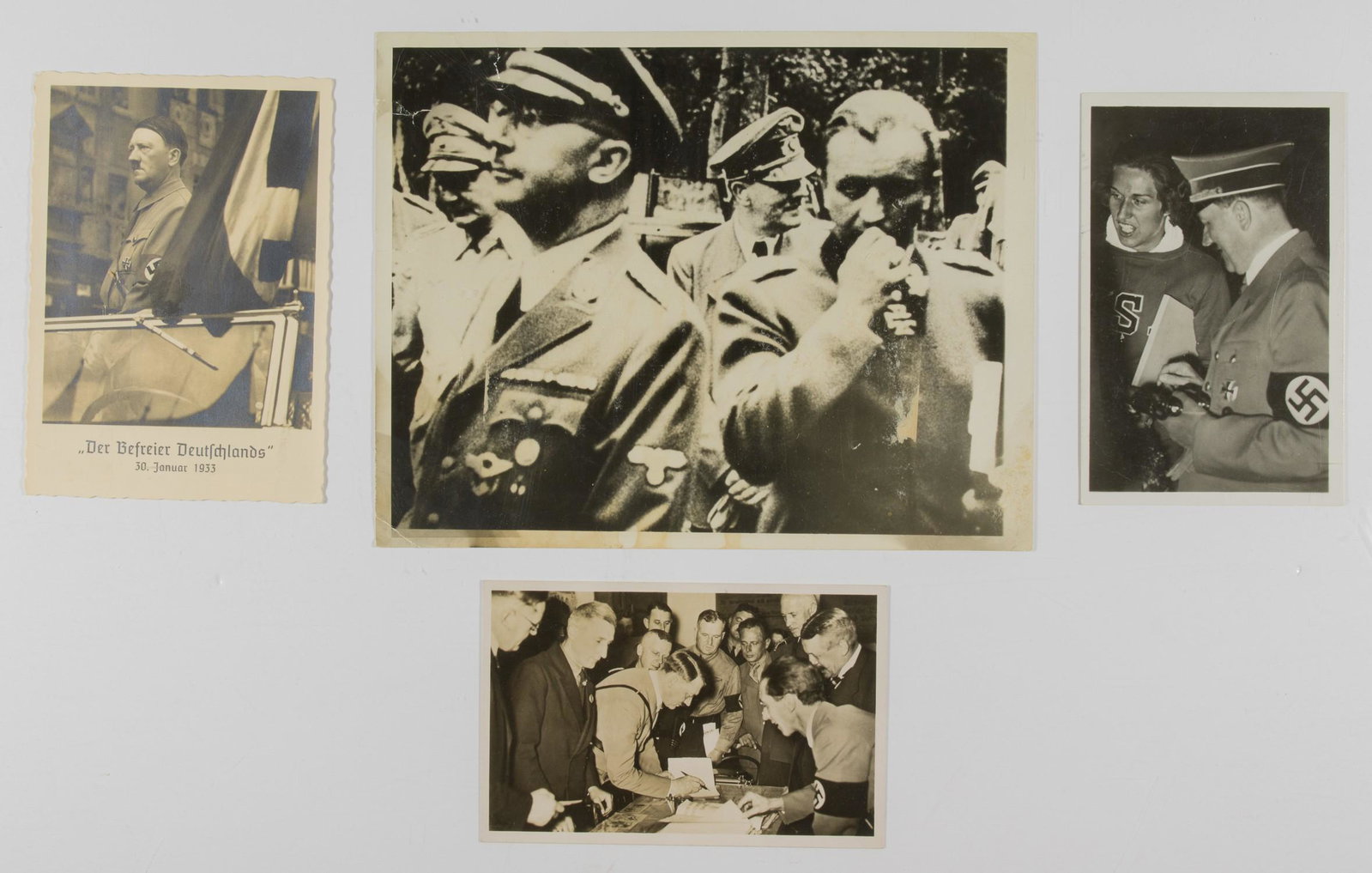 ADOLF HITLER PHOTOGRAPHS (6): A lot of six photographs, some bearing 'Associated Press Photo' stamps and typed captions, varying sizes, b/w, all images of Adolf Hitler. Scenes include Hitler with U.S. Olympian Helen Stephens, at t