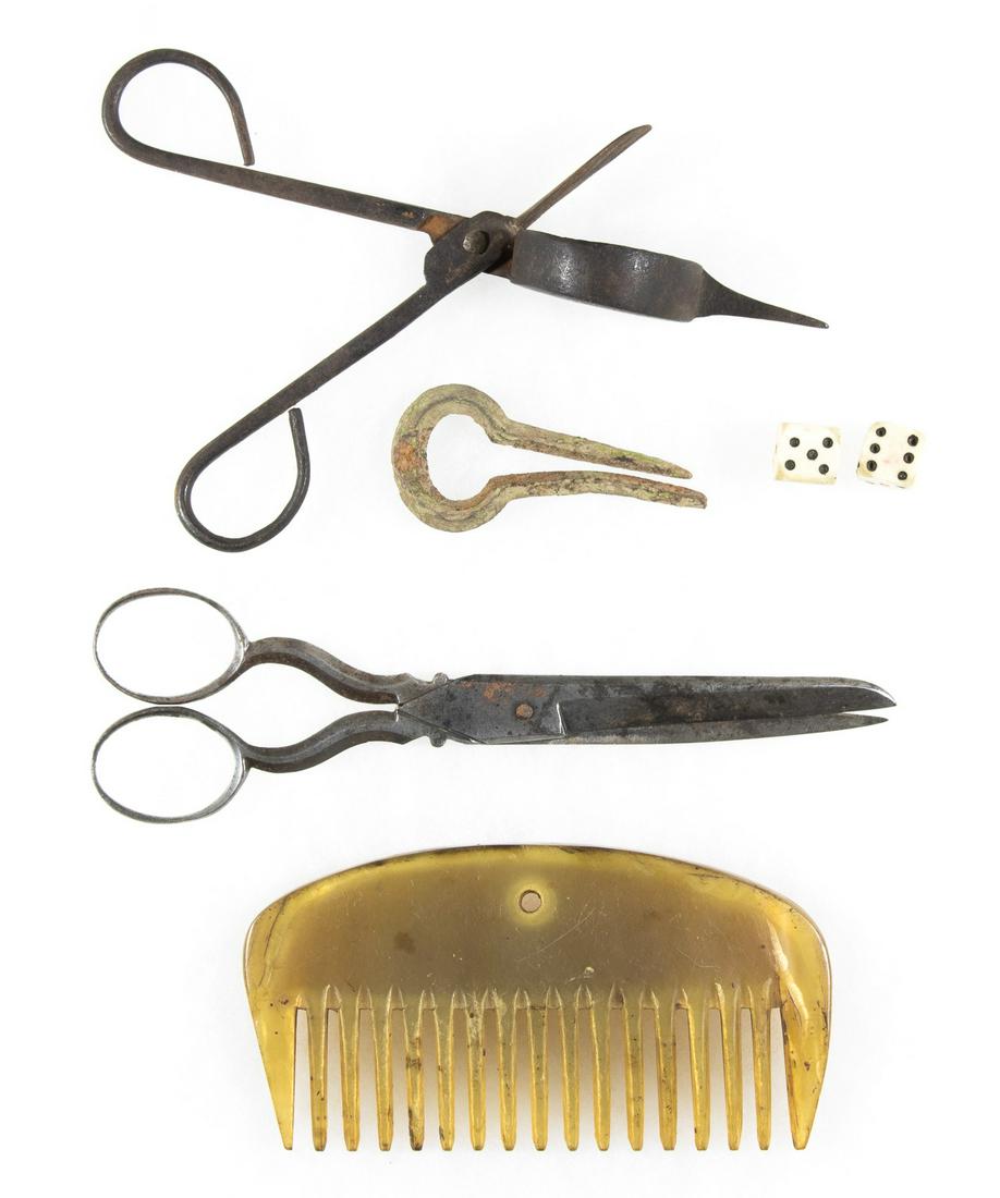 REVOLUTIONARY WAR CAMP ITEMS: A good lot of five items from the Revolutionary War era that would have been found in soldiersâ€™ camps including a 5 in. hand carved bone comb, a pair of dice with 'G. R.' import stamps, a parti