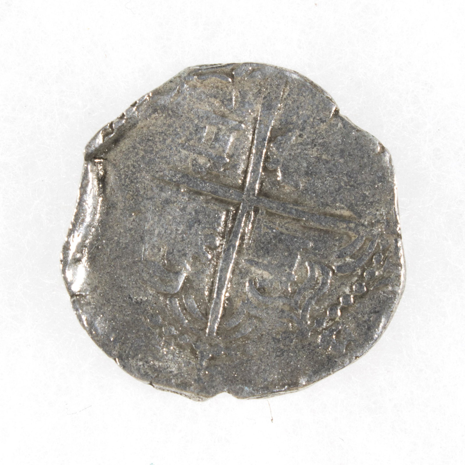 TWO REALE SILVER COIN FROM ATOCHA, WITH MEL FISHER: Silver two reale silver coin minted in Potosi, ca. 1598-1621 recovered by salvor Mel Fisher from the wreck of the NUESTRA SENORA DE ATOCHA, a fine strike, with original Treasure Salvors Inc. certifica