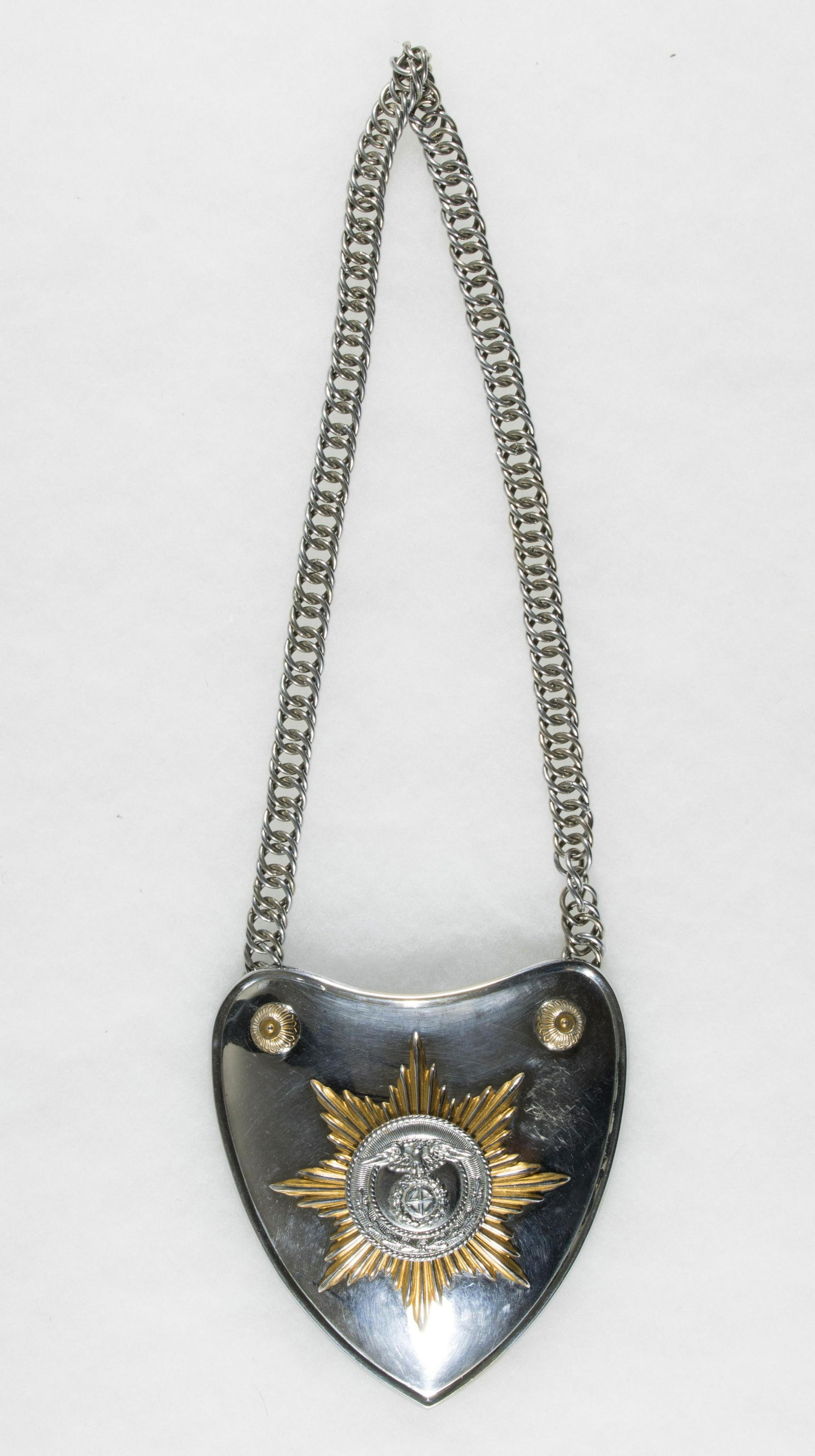 SA STANDARD BEARER'S GORGET: A very good example of the scarce early SA standard bearer's gorget, roughly 4.75 x 5 in., nickeled silver construction, the obverse features a first pattern SA open-winged eagle clutching a wreathed