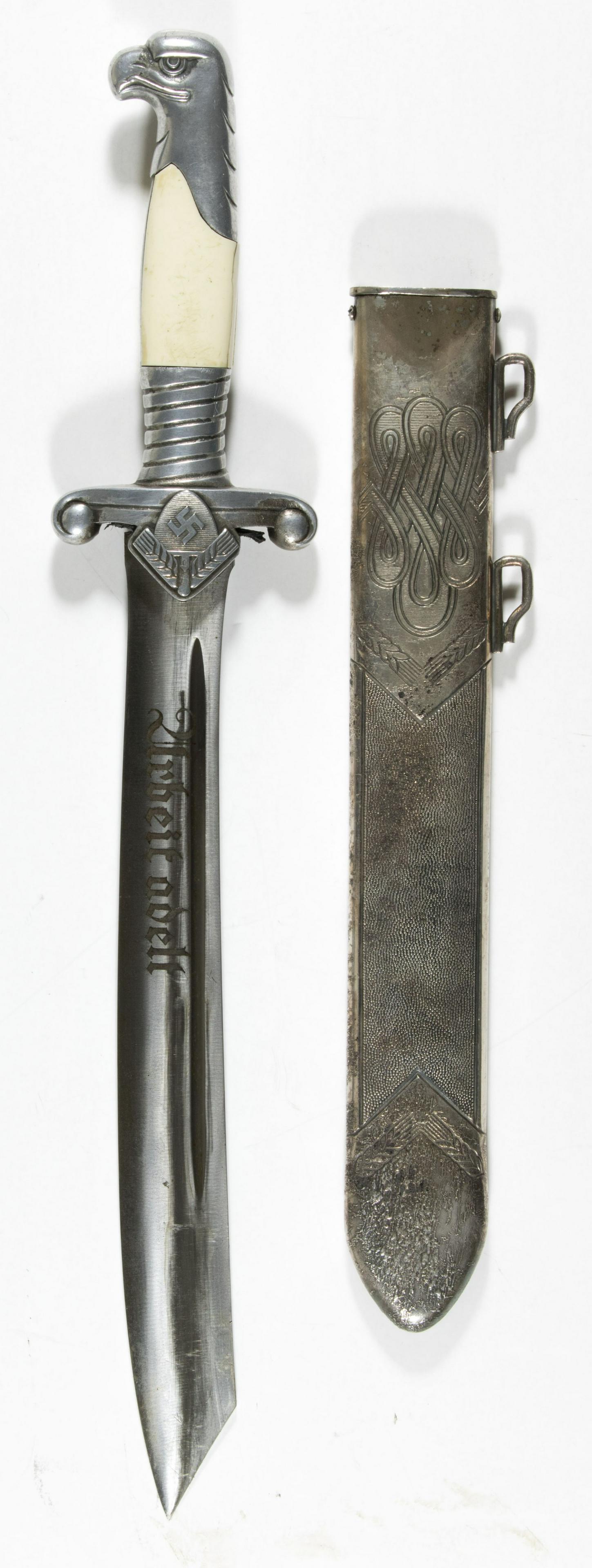 R.A.D. OFFICER'S DAGGER BY HOLLER: Rare R.A.D. officer's dagger by F.W. Holler, Solingen. The detail of the eagle head pommel and crossguard remains good, especially so with the mobile swastika and sheaves of wheat in RAD emblem, and t