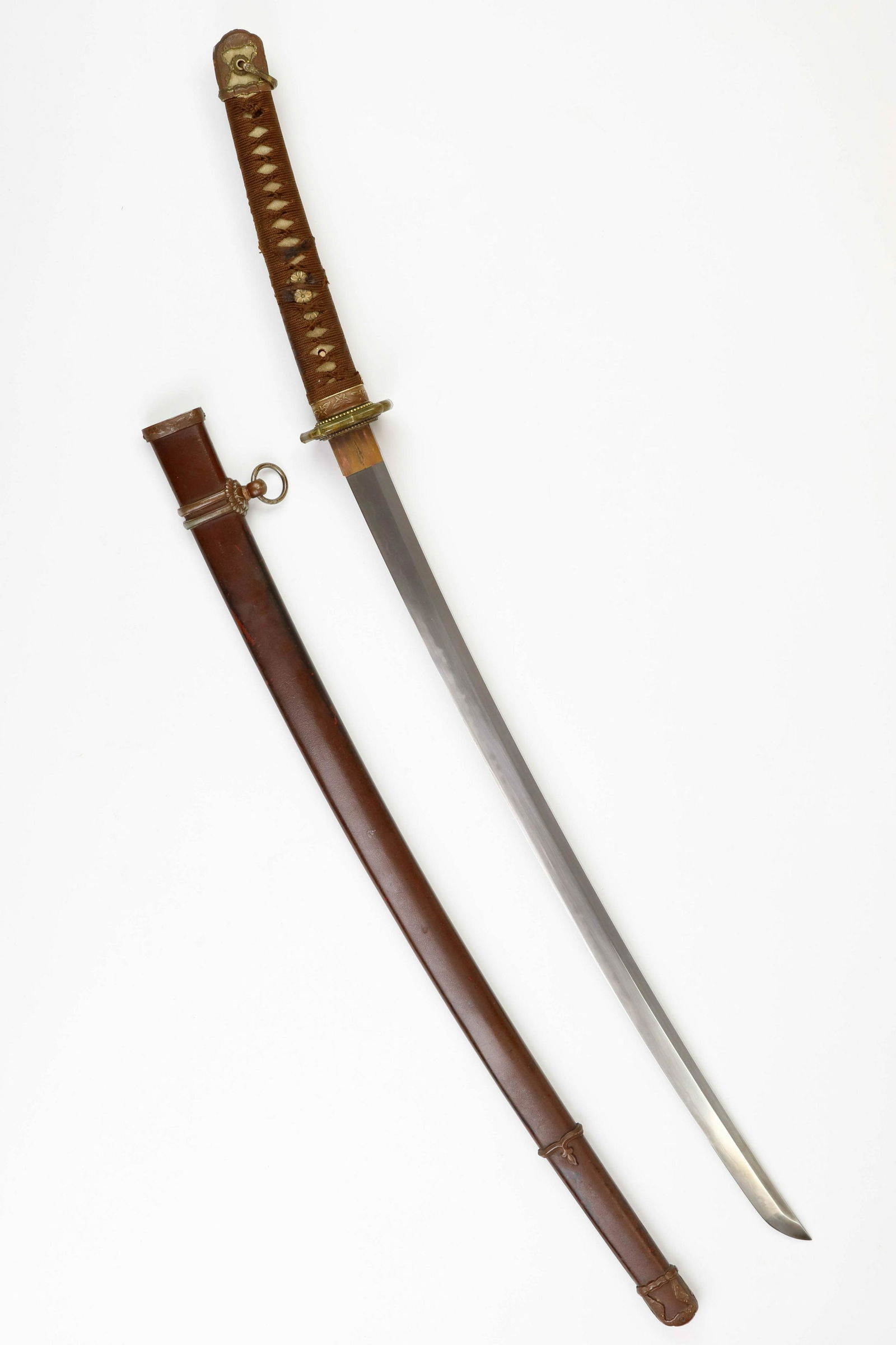 WORLD WAR II JAPANESE OFFICERâ€™S KATANA: Finely-forged late war Japanese officerâ€™s sword, a Type 98 Shin Gunto, measuring 28 in. from the 'kissaki' (â€˜tipâ€™) to the â€˜habakiâ€™ (â€˜stopâ€™), and 40 in. lo